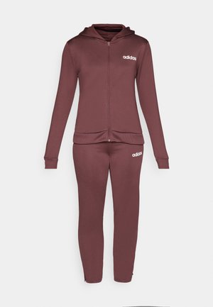 Tuta Adidas bordeaux, composta da una felpa con zip e pantaloni abbinati. Tessuto morbido, vestibilità slim, con logo Adidas bianco su entrambi i capi.