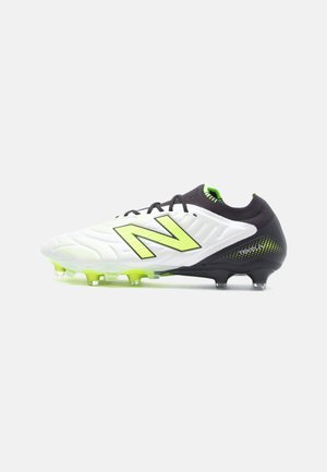 White and black soccer cleat with a textured upper, a neon green logo, and a black heel featuring a gradient pattern. Transparent studs.