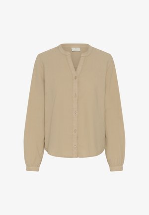 Bézs színű, hosszú ujjú blúz kerek nyakkivágással, gombos elejű és rugalmas mandzsettákkal.