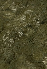 Olive green lace fabric featuring intricate patterns, delicate textures, and an open weave design with varying thread thickness.