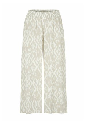 Beige Weite-Hosen mit elastischem Bund und weißem abstraktem Diamantmuster über den gesamten Stoff.