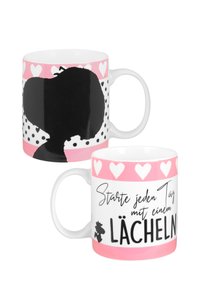 Tazza in ceramica con una silhouette nera lucida e pois, caratterizzata da una fascia con cuori rosa. Il testo recita "Inizia ogni giorno con un sorriso."