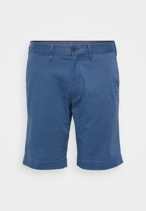 Pantaloni corti di mezzo lunghezza in cotone blu solido. Presentano una chiusura con bottone, passanti per cintura e orlo arrotolato. Tessuto liscio, senza motivi o dettagli visibili.