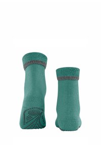 Calzini teal con polsino grigio a costine e texture antiscivolo a pois sulla soletta per una presa migliore. Materiale in maglia liscia con un design di altezza media.