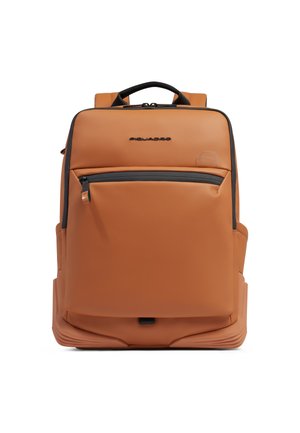 Tan leather backpack with black zipper pocket on front, padded handle, and Piquadro logo centered above pocket.
