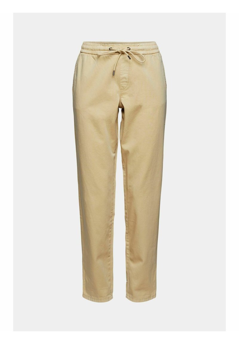 Pantalons beige avec taille élastique et cordon de serrage, dotés de poches latérales et d'un design de jambe fuselée. Tissu en coton doux.
