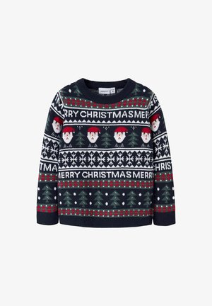 Pull en tricot bleu marine avec un motif festif comprenant des visages de Père Noël, des sapins de Noël, des flocons de neige et le texte « MERRY CHRISTMAS » en rouge et blanc.