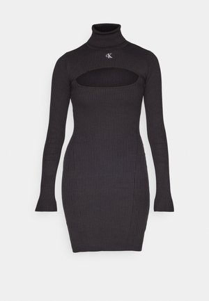 Gestreiftes schwarzes Kleid mit Stehkragen, langen Ärmeln und einem Cut-out vorne. Hat eine figurnahe Silhouette und ein CK-Logo auf der Brust.