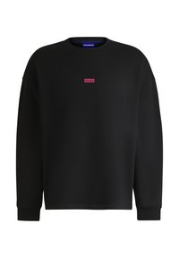 Felpa nera con scollo rotondo, maniche lunghe e un piccolo logo "HUGO" rosa centrato sul davanti. Tessuto misto cotone.