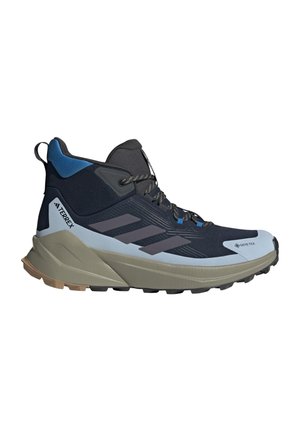 Mustansininen korkeavartinen Adidas Terrex -vaelluskengät Gore-Texillä, nauhallisella suljetuksella ja kestävä beige pohja, suunniteltu ulkokäyttöön.