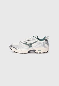 White and silver athletic shoe with green accents, mesh upper, and padded collar. Features a textured sole for traction.