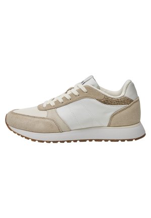 Beige and white sneaker featuring suede and leather materials, a textured heel, and a rubber sole. Classic lace-up design with subtle accents.