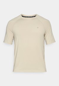 Rövid ujjú bézs póló sima anyagból. Kerek nyakkivágással és diszkrét logóval a mell részen, letisztult dizájnnal, minta nélkül.