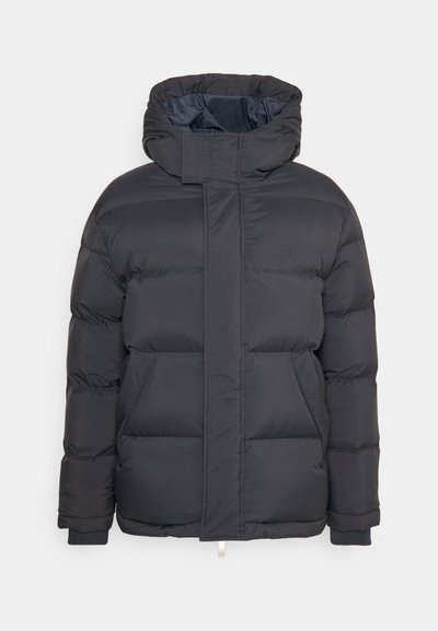 Black puffer jacket with a high collar and hood, featuring quilted sections, front zip closure, and ribbed cuffs. Smooth texture.