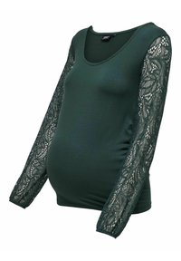 Haut de maternité vert foncé avec encolure dégagée et manches longues en dentelle ornées de motifs floraux.