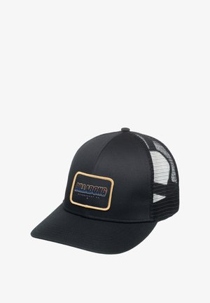 Black cap with a solid front and mesh back, featuring a rectangular patch with “BILLABONG” in blue and red text on beige background.