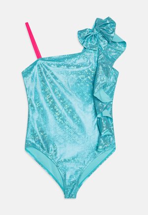 Turkist badedrakt i ett stykke med skinnende, teksturert stoff, som har en rosa stropp og en siderynke med en sløyfedetalj.