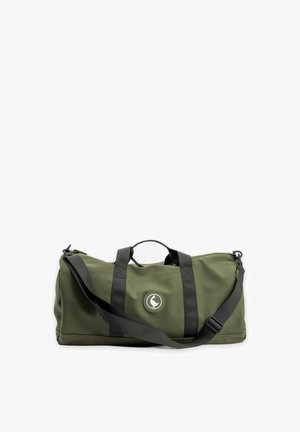 Bolsa de lona verde oliva con correas negras y correa de hombro ajustable, que muestra un logotipo circular con un pato blanco.