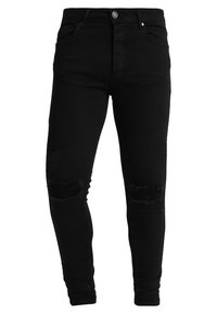 Pantalones vaqueros ajustados de mezclilla negra que presentan detalles desgastados en las rodillas, cinco bolsillos, cierre de botón y un ajuste ceñido a lo largo de las piernas.