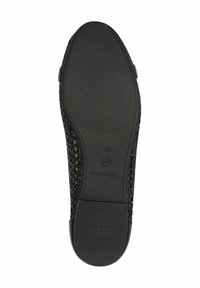 Tige en textile tissé noir avec une semelle extérieure en caoutchouc solide. Présente un motif texturé et un talon légèrement surélevé. Taille 37 affichée.