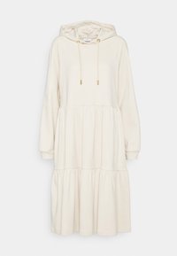 Robe à capuche couleur crème en tissu doux, présentant un design à volants et une flamme, avec des accents de cordon en métal doré sur la capuche.