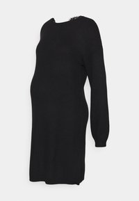 Czarna, dzianinowa sukienka ciążowa o luźnym kroju, z długimi rękawami i teksturowanym materiałem. Posiada okrągły dekolt i boczne rozcięcia.