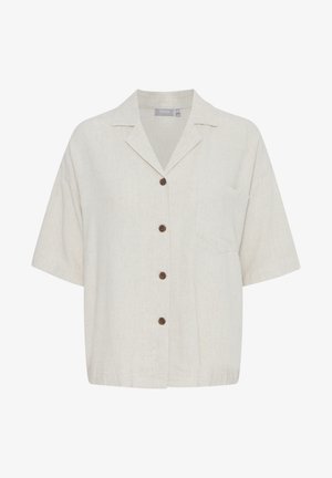 Rövid ujjú, bézs lenvászon ing, gallérral, öt barna gombbal és egy mellzsebbél. Könnyű anyag, egyszerű textúrával.