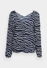 Blusa a maniche lunghe blu navy con strisce bianche irregolari a serpentina, scollo a V e chiusura frontale con bottoni, su uno sfondo chiaro uniforme.