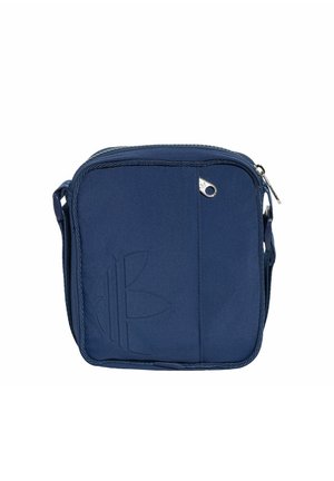 Navy blue square crossbody bag with a front zipper pocket, adjustable strap, and embossed logo on the lower left corner.