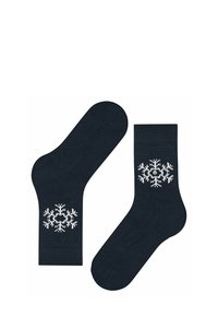 Granatowe skarpetki z prążkowanym mankietem mają po boku biały wzór śnieżynki. Wykonane z miękkiej, teksturowanej tkaniny dla komfortu.