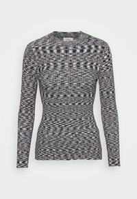 Maglia a maniche lunghe con motivo bianco e nero, in tessuto a maglia testurizzata, forma aderente, scollo rotondo, caratterizzata da un sottile design a zigzag su tutta la superficie.