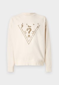 Felpa beige chiaro con colletto a girocollo, caratterizzata da una grafica triangolare testurizzata in oro e bianco con il testo "GUESS" e "CA".