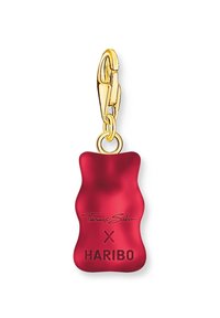 Sile punane kummikaru ripats, mis on valmistatud siledast vaigust ja millel on kuldne metallist klamber. Sellel on ka tekst "Thomas Sabo" ja "X HARIBO".