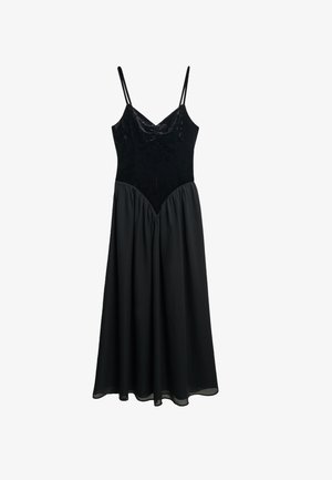 Black dress with a velvet bodice and a flowing chiffon skirt. Features thin straps and a sweetheart neckline with gathered fabric at the waist.
