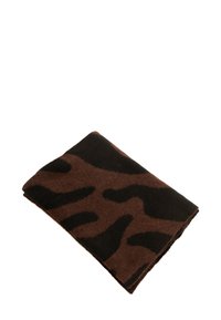 Couverture en laine brune avec un motif abstrait noir audacieux. Le tissu a une texture douce et est soigneusement plié avec des bords nets.