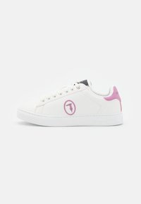 White leather sneaker with a pink logo, pink heel accent, flat white sole, and round laces. Features a simple and clean design.