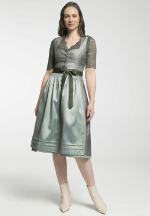 A midi dress with a textured silver bodice, lace sleeves, and a woven green skirt. Finished with a matching ribbon belt and subtle pleats.