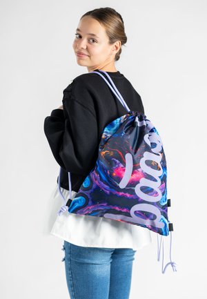 Drawstring backpack in a vibrant galaxy print with purple, pink, and blue swirls; features two drawstrings and a soft fabric texture.