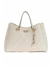 Borsa trapuntata beige con doppi manici, dettagli dorati e logo. Presenta una chiusura con cerniera e un ciondolo rimovibile per un tocco in più.