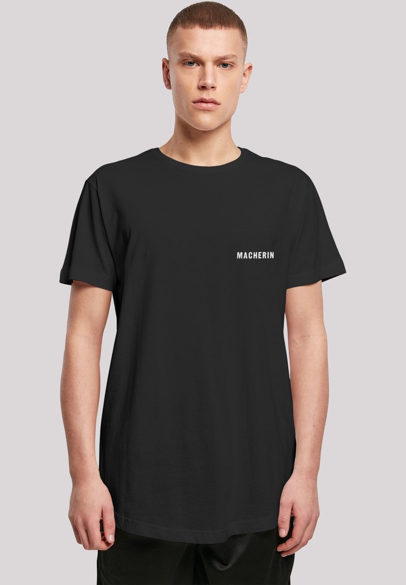 Black short-sleeve t-shirt featuring a crew neckline and white "MACHERIN" text on the left chest; smooth cotton fabric.