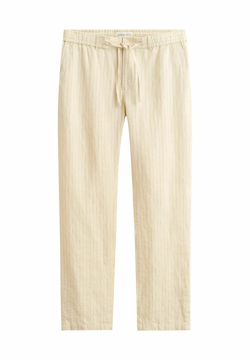 Pantalones beige con cordón, con sutiles rayas verticales, cintura elástica, bolsillos laterales y corte recto.