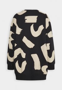 Sweat-shirt noir à manches longues avec de grands motifs abstraits beiges en coups de pinceau dans le dos et sur les manches.