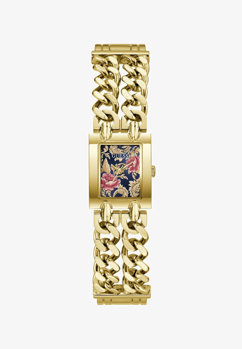 Montre-bracelet à maillons dorés avec cadran noir rectangulaire à motif floral et aiguilles dorées, marque Guess sur le cadran.