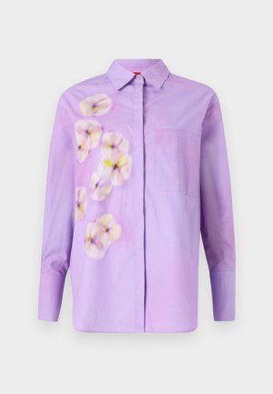 Camicetta viola con bottoni, caratterizzata da una stampa floreale in tonalità tenui, con una tasca sul petto e maniche lunghe. Tessuto di cotone morbido.