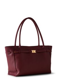 Burgundy leather tote bag with textured surface, two long handles, and gold hardware accent, featuring a central strap detail.