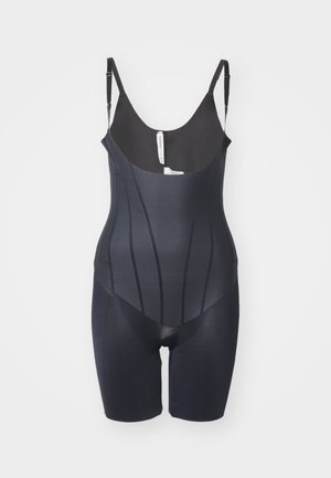 Black shaping bodysuit made of smooth elastic fabric. Features adjustable straps and vertical ribbing for structure and shape. Mid-thigh length.