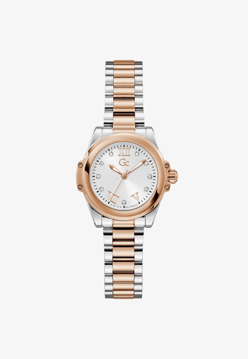 Rosaguld og sølvfarvet metallisk armbåndsur med rund urskive, hvid urskive, romertal og diamant-timeindikatorer på et ledet armbånd.