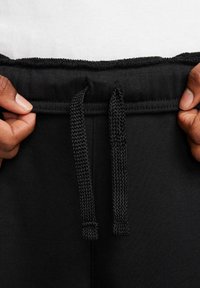 Nike Sportswear Pantaloni sportivi - schwarz