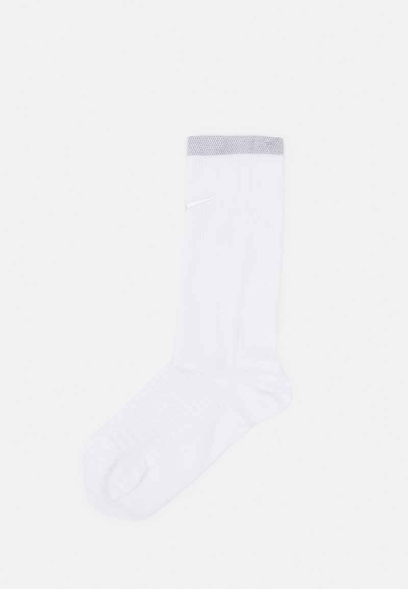 White athletic sock with gray ribbed cuff, featuring a subtle logo and textured footbed for grip, designed for comfort and performance.