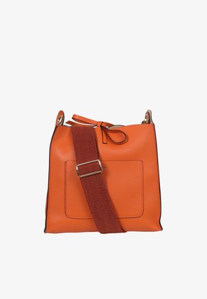 Orange leather handbag with a textured surface, square shape, and a detachable red fabric strap featuring a metal buckle. Includes a front pocket.